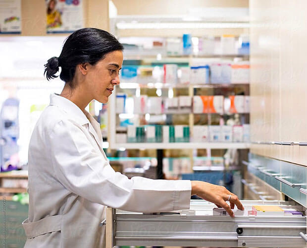A woman looking at prescriptions